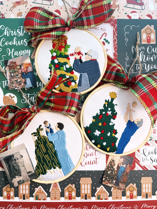 Three embroidered ornaments of a man and child. Featured on a holiday themed background.