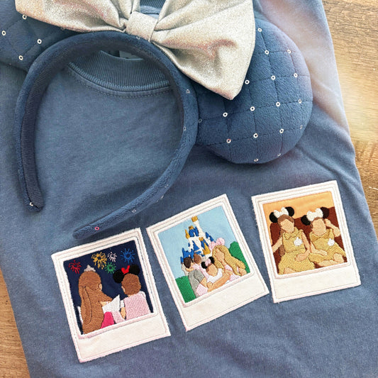 Blue t-shirt with themed headband and Polaroid-style photos on a wooden surface