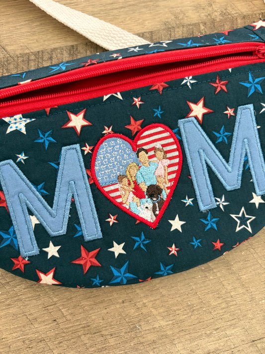 Crossbody bag with patriotic star fabric and “MOM” embroidered with a portrait. 