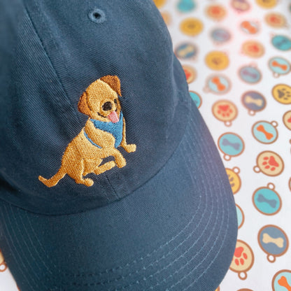 Blue hat with an embroidery design of a dog. 