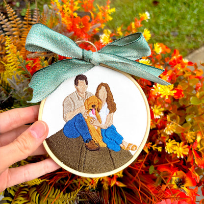Fall floral background with a custom embroidered ornament of a family with dog.