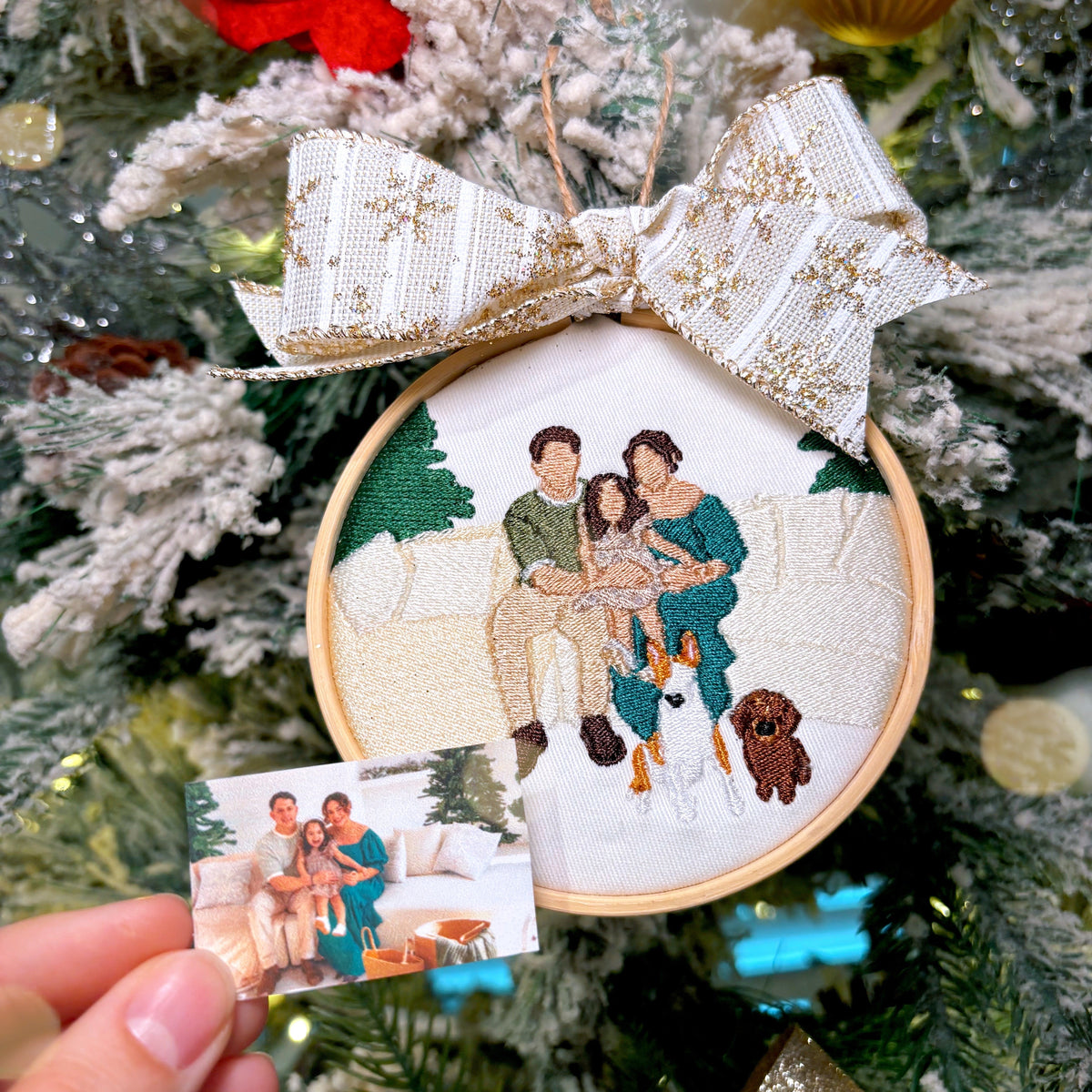 Christmas tree background with ornaments and a custom embroidered ornament in focus of a family.