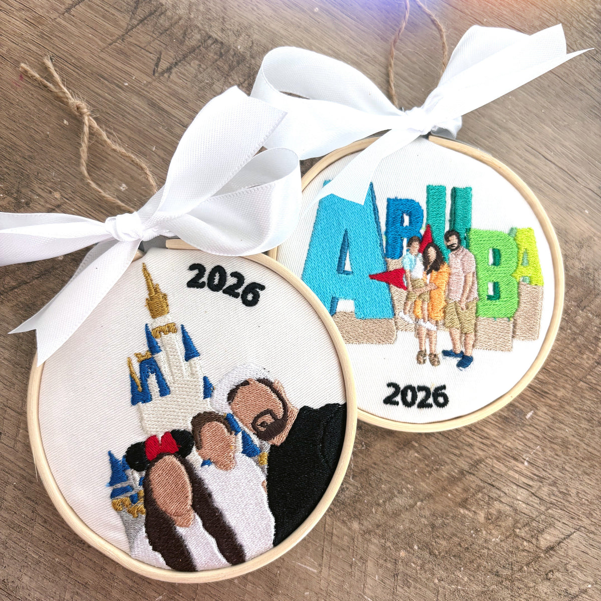 Wood background with two custom embroidered ornaments featured on it.